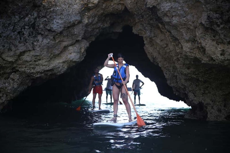 Albufeira: Caves and cliffs Paddleboarding (SUP) Tour - Cliffside sightseeing and cave passage: the core experience