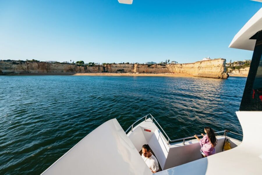 From Albufeira: Sunset Cruise and Beach BBQ with Open Bar - DJ, fire performer, and live entertainment: the vibe shift from cruise to party