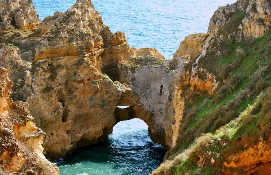From Lagos: Cruise to the Caves of Ponta da Piedade - Entering the sea caves: tight passages, skilled driving, and real thrills
