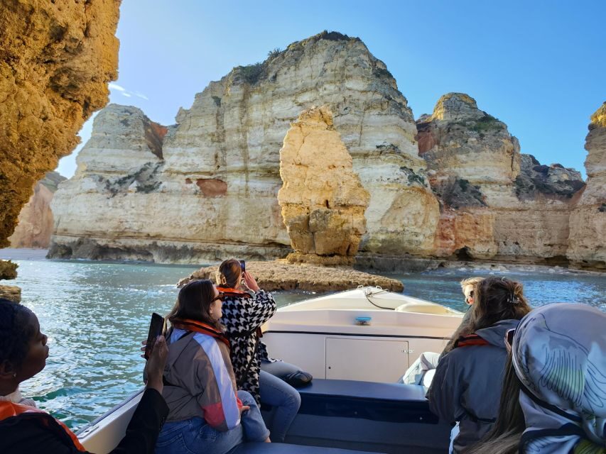 Lagos: Guided Ponta da Piedade Sunset Boat Tour - Cave interiors: Cathedral, Kitchen, Living Room, and Skull