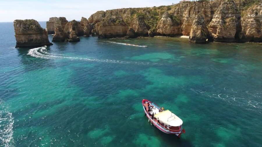 Lagos: Ponta da Piedade Cave and Coastal Tour - Entering Ponta da Piedade caves on a smaller boat